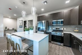 Las Vegas apartment for rent - A modern eat-in kitchen with a large island and stainless steel appliances.