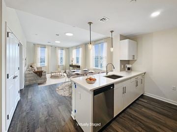 Bound Brook apartment for rent - A kitchen with a dining table and chairs in front of a window.
