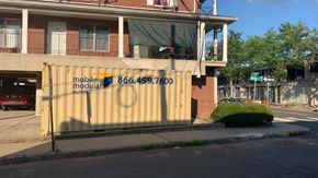 Bound Brook apartment for rent - A building with a sign that says "mobile modular" and a phone number on it.