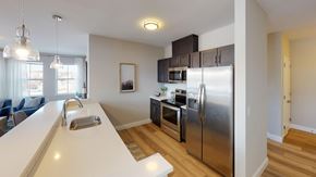 Newark apartment for rent - A kitchen with a white counter top and stainless steel appliances.