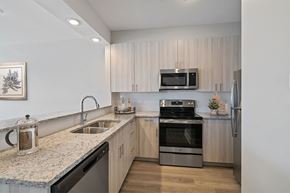 Poughkeepsie apartment for rent - A modern kitchen with a granite countertop and stainless steel appliances.