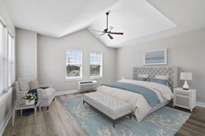 Poughkeepsie apartment for rent - A bedroom with a large bed and a ceiling fan.