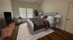 Pine Plains apartment for rent - A bedroom with a bed, chair, and a television.
