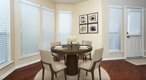 Bossier City apartment for rent - A dining room with a round table and chairs.