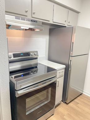 Shreveport apartment for rent - A modern kitchen with a stainless steel refrigerator and oven.
