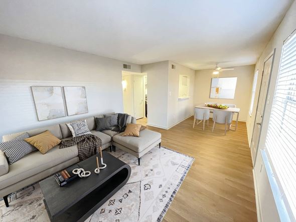 Shreveport apartment for rent - A living room with a grey couch and a coffee table.