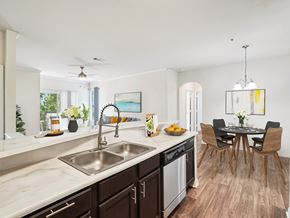 Cary apartment for rent - A modern kitchen with a dining table and chairs.