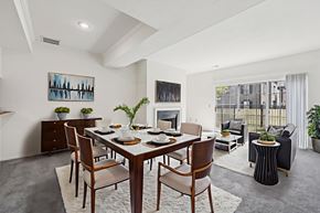 Dublin apartment for rent - A dining room with a table set for six and a painting on the wall.