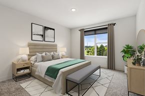 Blue Ash apartment for rent - A bedroom with a large bed and a window with curtains.