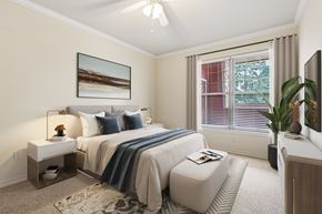 Cincinnati apartment for rent - A bedroom with a large bed and a painting on the wall.