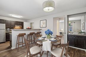 Cincinnati apartment for rent - A kitchen with a dining table set for four.
