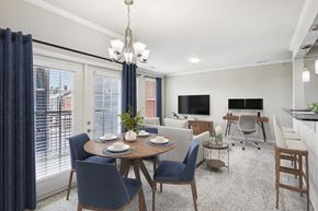 Zionsville apartment for rent - A dining room with a round table and blue chairs.