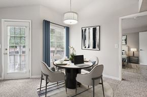 Cincinnati apartment for rent - A dining room with a round table and chairs.
