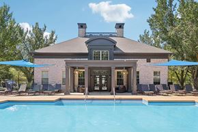 Dublin apartment for rent - A house with a pool in front of it.