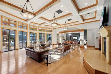 St. Louis Park apartment for rent - A living room with a brown leather couch and a wooden floor.