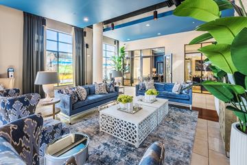 Cary apartment for rent - A living room with a blue couch and a white coffee table.