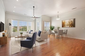 San Antonio apartment for rent - A living room with a dark blue chair in the center.