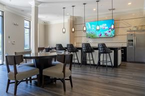 Charlotte apartment for rent - A modern dining room with a large table and chairs.