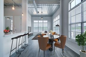 Atlanta apartment for rent - A modern dining room with a large table and chairs.