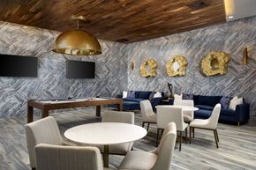 Denver apartment for rent - A modern dining room with a round table and chairs.
