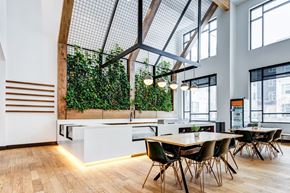 Littleton apartment for rent - A modern dining area with a wooden table and chairs.