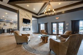 Louisville apartment for rent - A living room with a fireplace and a television.