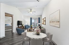 San Antonio apartment for rent - A dining room with a white table and grey chairs.