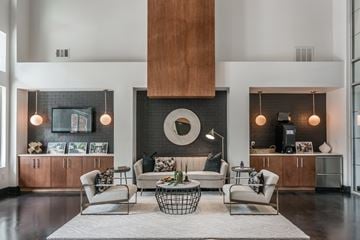 Franklin apartment for rent - A modern living room with a large sofa set and a fireplace.