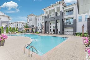 Franklin apartment for rent - A swimming pool in a residential area with buildings in the background.