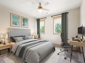 Durham apartment for rent - A bedroom with a large bed, a desk, and a chair.