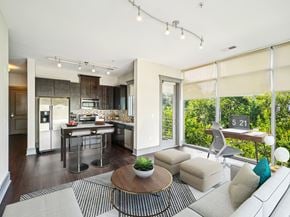 Durham apartment for rent - A modern kitchen with a dining table and a couch.
