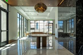 Santa Rosa apartment for rent - A modern dining room with a round table and a chandelier.