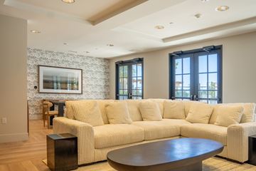 Santa Rosa apartment for rent - A living room with a large couch and a coffee table.
