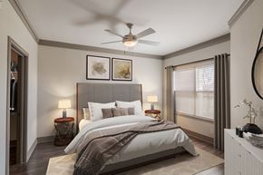 Prosper apartment for rent - A bedroom with a large bed and a ceiling fan.