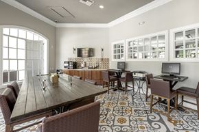Tampa apartment for rent - A dining room with a long table and chairs.