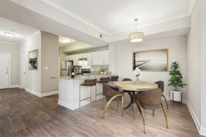 Atlanta apartment for rent - A kitchen with a dining table and chairs.