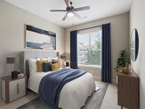 Cary apartment for rent - A bedroom with a large bed and a ceiling fan.