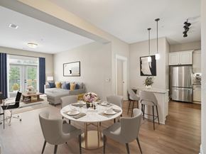 Cary apartment for rent - A modern dining room with a table set for four.