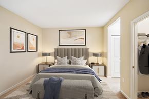 Woodbury apartment for rent - A bedroom with two beds and a painting on the wall.