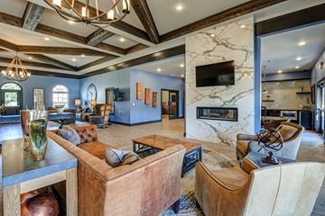 Louisville apartment for rent - A living room with a brown couch and a fireplace.
