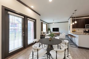 Louisville apartment for rent - A modern dining room with a round table and white chairs.