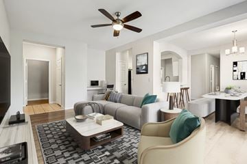 Mason apartment for rent - A modern living room with a grey sofa and a wooden coffee table.