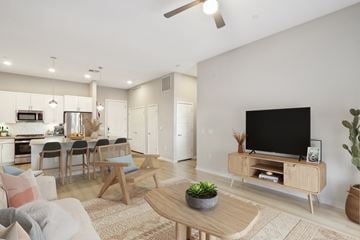 Scottsdale apartment for rent - A modern living room with a wooden coffee table and a flat screen TV.