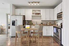 Franklin apartment for rent - A modern kitchen with a table and chairs in the middle.