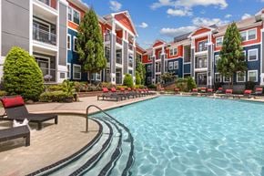 Charlotte apartment for rent - A large swimming pool in front of apartment buildings.