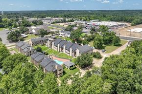 Nacogdoches apartment for rent - A bird's eye view of a residential area with houses and trees.