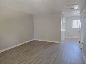 Austin apartment for rent - A room with wooden flooring and white walls.