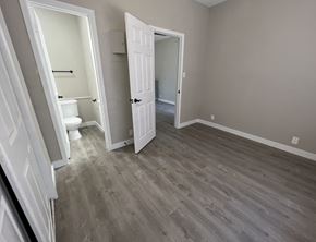 Austin apartment for rent - A room with a toilet and a door is shown.