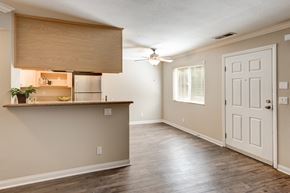 Escondido apartment for rent - A room with a wooden floor and a white door.