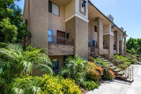 La Mesa apartment for rent - A building with a balcony and a metal railing.
